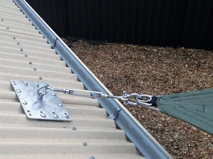 Large galvanised shade sail roof plate with a turnbuckle running out over the gutter
